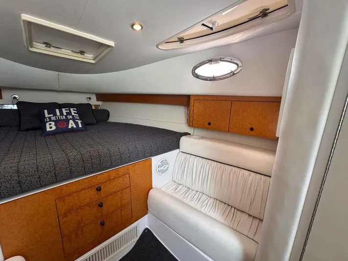  Yacht Photos Pics Interior of 2008 Donzi 38 ZSF boat with cozy bed and wooden cabinets.