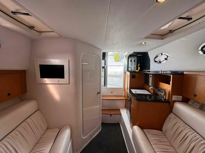  Yacht Photos Pics Interior of 2008 Donzi 38 ZSF boat with modern amenities and comfortable seating.