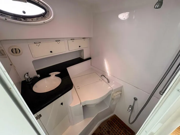  Yacht Photos Pics 2008 Donzi 38 ZSF boat bathroom with sink, shower, and storage cabinets.