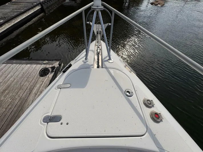  Yacht Photos Pics Bow of a 2008 Donzi 38 ZSF boat docked by the water.