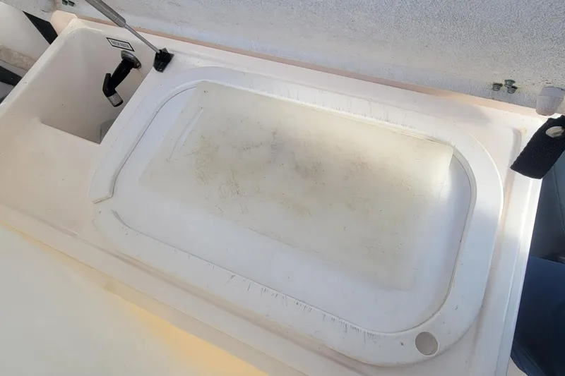 Valkyrie Yacht Photos Pics 2004 Pursuit 3400 Offshore boat sink and cutting board area.