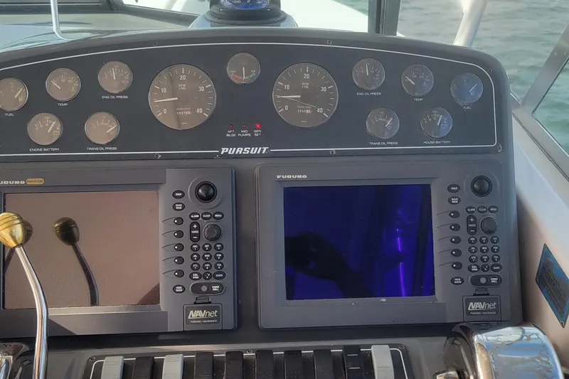 Valkyrie Yacht Photos Pics Dashboard of a 2004 Pursuit 3400 Offshore boat with navigation instruments.