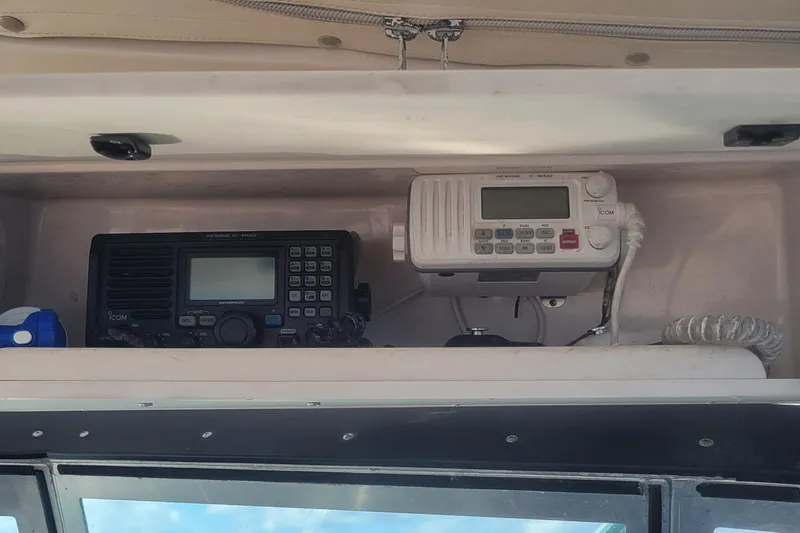Valkyrie Yacht Photos Pics 2004 Pursuit 3400 Offshore boat radio equipment, featuring Icom marine radios in cabin.
