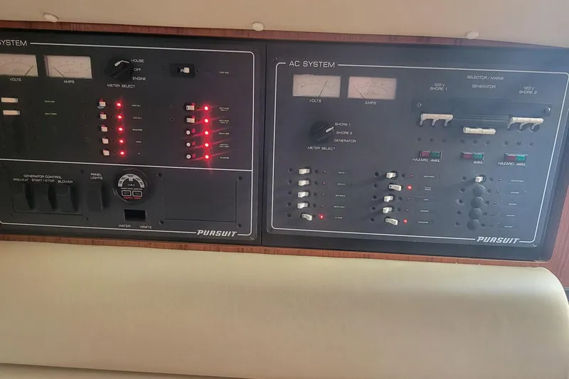 Valkyrie Yacht Photos Pics Control panel of a 2004 Pursuit 3400 Offshore boat with illuminated indicators.