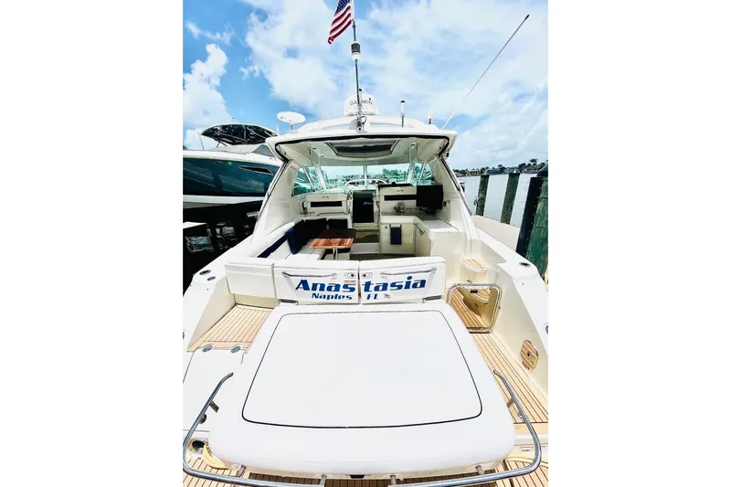  Yacht Photos Pics 2010 Sea Ray 450 Sundancer yacht docked, featuring spacious deck and luxurious interior.