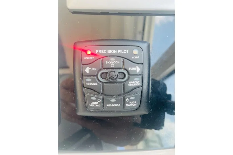  Yacht Photos Pics Control panel of a 2010 Sea Ray 450 Sundancer boat, featuring Precision Pilot system.