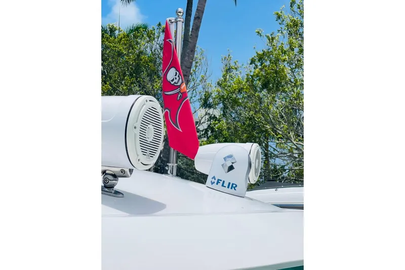  Yacht Photos Pics 2010 Sea Ray 450 Sundancer with FLIR camera and pirate flag, surrounded by trees.