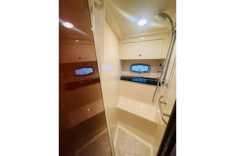  Yacht Photos Pics Luxurious bathroom in 2010 Sea Ray 450 Sundancer yacht with shower and porthole window.