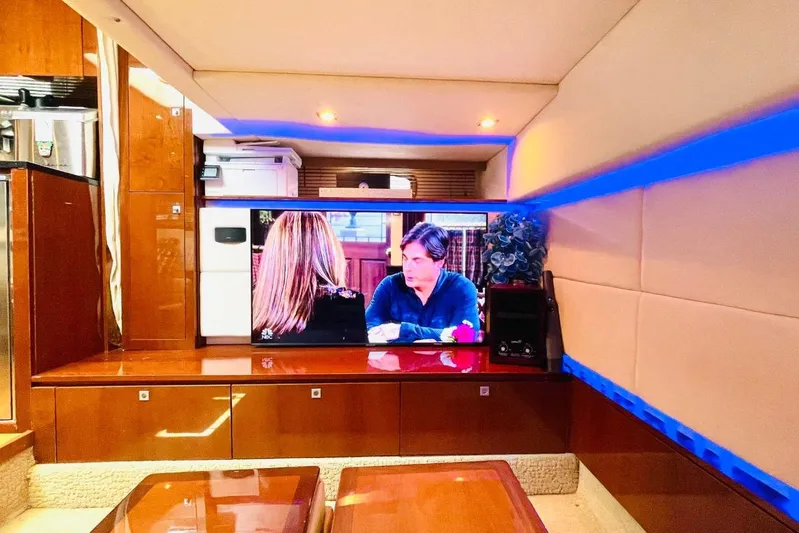  Yacht Photos Pics Luxurious interior of 2010 Sea Ray 450 Sundancer yacht with TV and modern decor.