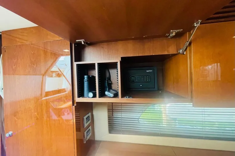  Yacht Photos Pics Interior of 2010 Sea Ray 450 Sundancer with wooden cabinetry and secure safe.