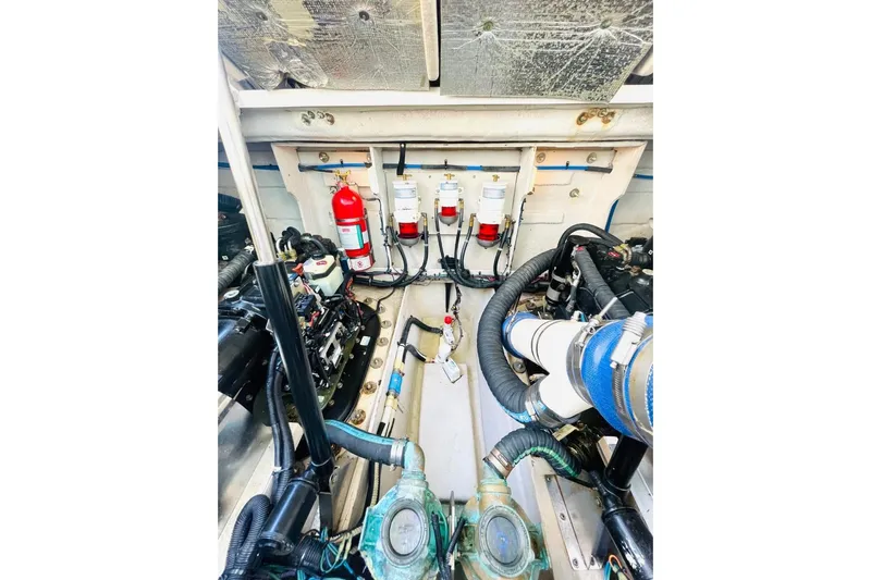  Yacht Photos Pics Engine room of 2010 Sea Ray 450 Sundancer with fire extinguisher and mechanical components.