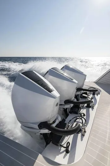  Yacht Photos Pics 2024 Azimut Verve 42 boat with triple outboard engines cruising on open water.
