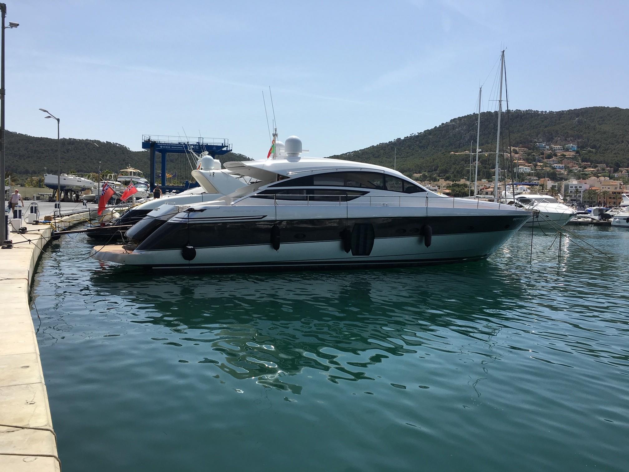 2010 Pershing 64 yacht docked in a serene marina setting.