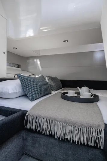  Yacht Photos Pics Luxurious interior of 2024 Azimut Verve 42 yacht with cozy bedding and elegant decor.