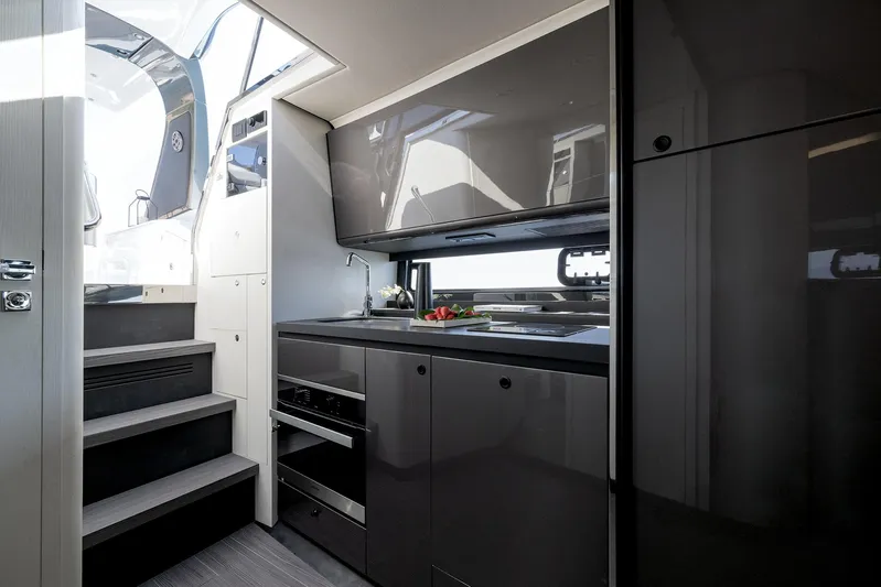  Yacht Photos Pics 2024 Azimut Verve 42 yacht interior kitchen with modern appliances and sleek design.