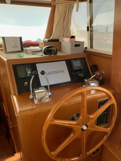 Sundog Yacht Photos Pics 1996 Ocean Alexander 423 Classico helm with Garmin navigation system.
