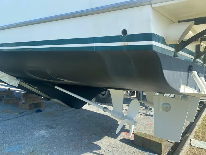 Sundog Yacht Photos Pics 1996 Ocean Alexander 423 Classico boat hull and propeller in dry dock.