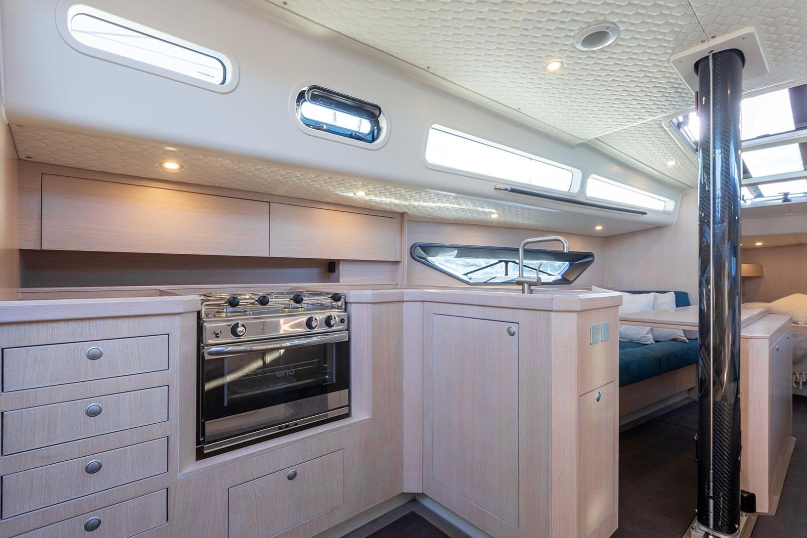 Modern Shogun 43 yacht interior with sleek kitchen and cozy seating, 2023 model.