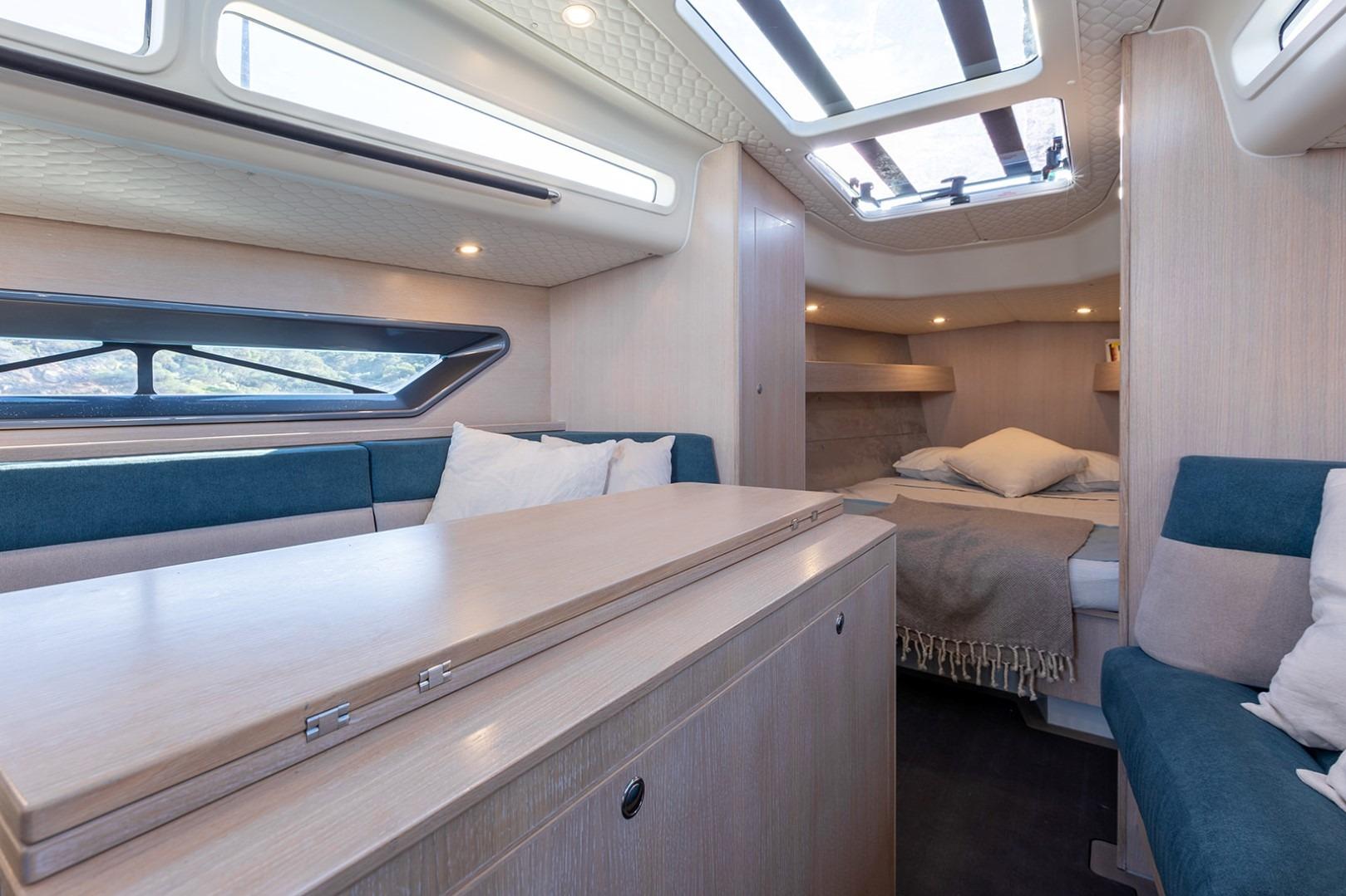 Luxurious interior of 2023 Shogun 43 yacht with modern furnishings and ample natural light.
