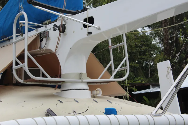 Panta Rhei Yacht Photos Pics Close-up of a 2012 Custom Roake 50 sailboat deck with rigging and blue cover.