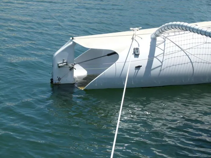 Panta Rhei Yacht Photos Pics Custom Roake 50 catamaran bow, 2012 model, floating on calm water.