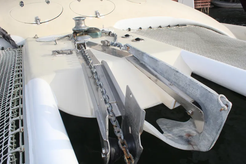 Panta Rhei Yacht Photos Pics Anchor system on 2012 Custom Roake 50 catamaran, featuring dual anchors and chain mechanism.