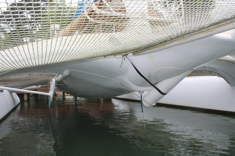 Panta Rhei Yacht Photos Pics Underneath view of a 2012 Custom Roake 50 catamaran on water.