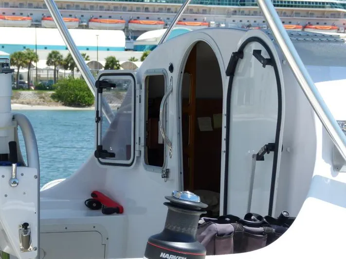 Panta Rhei Yacht Photos Pics Custom Roake 50 sailboat, 2012 model, docked with open cabin door.