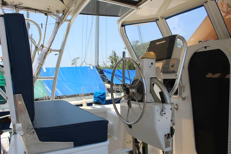 Panta Rhei Yacht Photos Pics Helm of 2012 Custom Roake 50 yacht with steering wheel and navigation equipment.