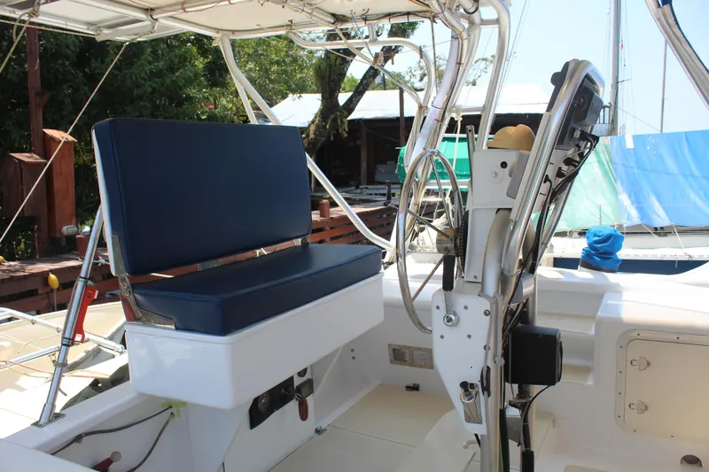 Panta Rhei Yacht Photos Pics Cockpit of 2012 Custom Roake 50 boat with blue seating and steering wheel.