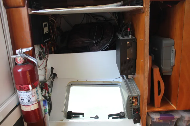 Panta Rhei Yacht Photos Pics Interior of a 2012 Custom Roake 50 boat with equipment and fire extinguisher.