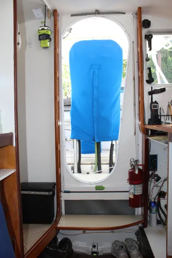 Panta Rhei Yacht Photos Pics Interior view of 2012 Custom Roake 50 boat with blue-covered doorway.