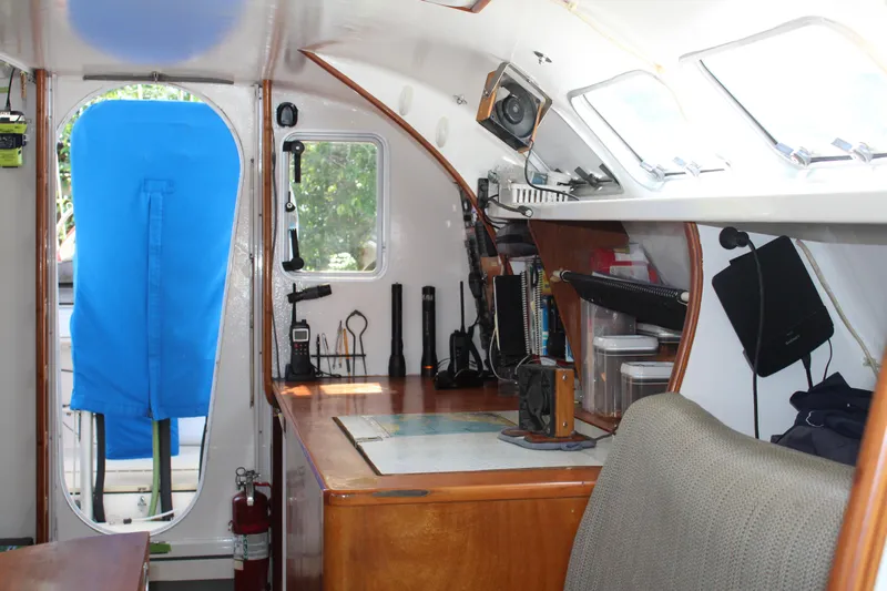 Panta Rhei Yacht Photos Pics Interior of 2012 Custom Roake 50 boat with navigation desk and equipment.