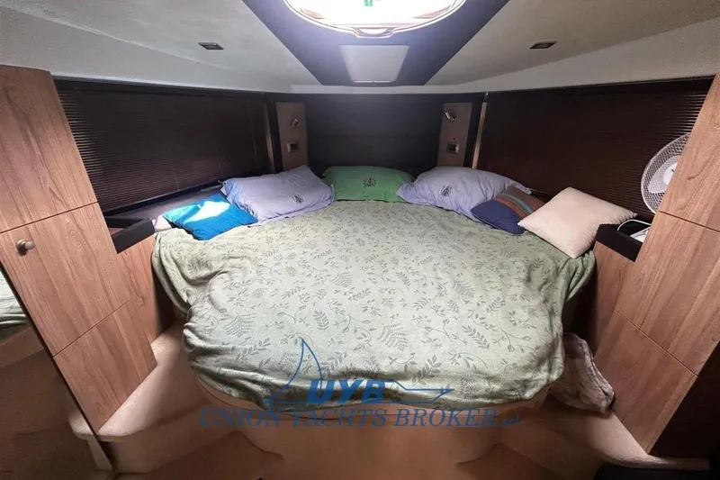  Yacht Photos Pics Luxurious cabin interior of 2015 Cranchi M 44 HT yacht with cozy bedding.