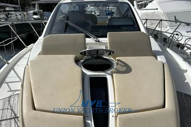  Yacht Photos Pics 2015 Cranchi M 44 HT yacht with beige sunbathing cushions at marina.