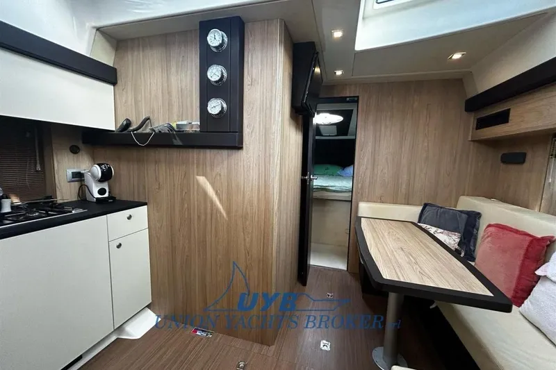  Yacht Photos Pics Interior of 2015 Cranchi M 44 HT yacht with modern kitchen and cozy seating area.