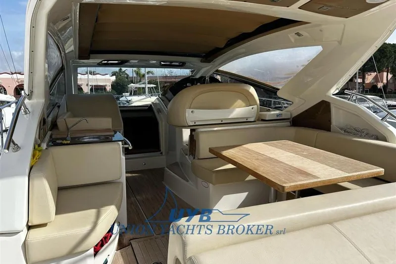  Yacht Photos Pics 2015 Cranchi M 44 HT yacht interior with seating and table.