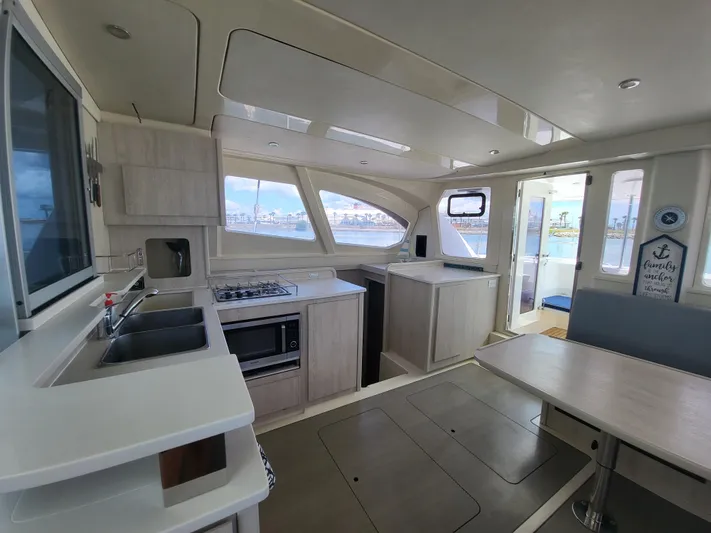 Ohana Yacht Photos Pics Interior of a 2016 Leopard 44 yacht with modern kitchen.
