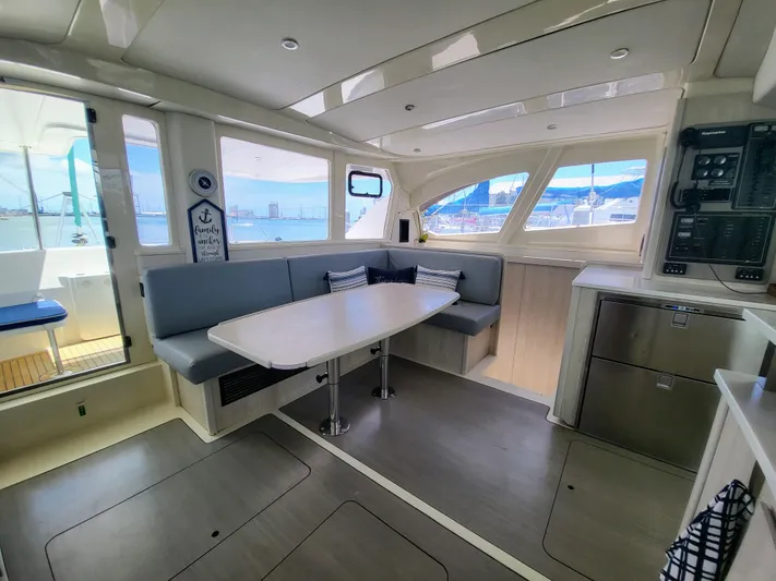 Ohana Yacht Photos Pics Interior of a 2016 Leopard 44 yacht with modern dining area.