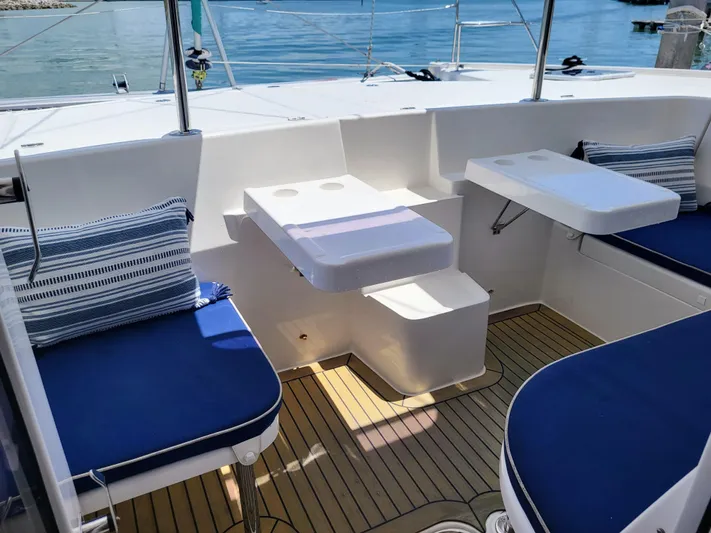 Ohana Yacht Photos Pics Leopard 44 Yacht 2016 with blue cushions and wooden deck.