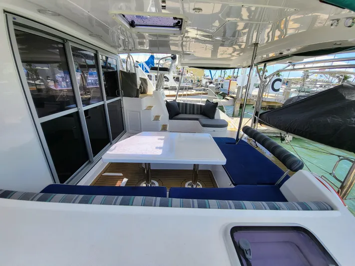 Ohana Yacht Photos Pics Leopard 44 catamaran 2016, spacious deck with seating area and table.