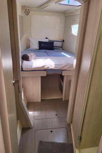 Ohana Yacht Photos Pics Interior of a Leopard 44 yacht, bedroom with bed and window.