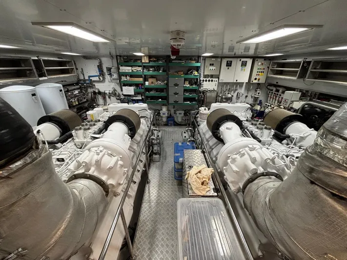 Queen Of Sheba Yacht Photos Pics Engine room of 2006 Ferretti Yachts 112 Custom Line, featuring dual engines and control panels.
