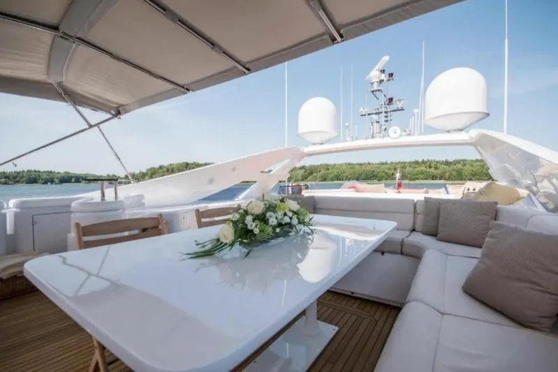 Queen Of Sheba Yacht Photos Pics Luxurious 2006 Ferretti Yachts 112 Custom Line deck with elegant seating and table arrangement.