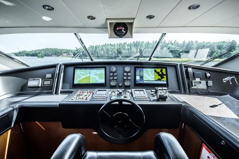 Queen Of Sheba Yacht Photos Pics Cockpit of 2006 Ferretti Yachts 112 Custom Line with navigation screens and controls.