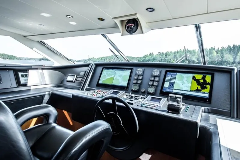 Queen Of Sheba Yacht Photos Pics Helm of 2006 Ferretti Yachts 112 Custom Line with navigation screens and controls.