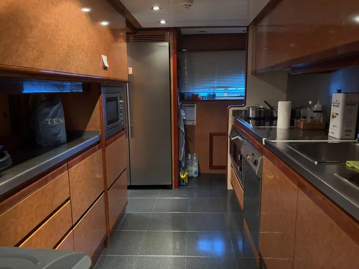 Queen Of Sheba Yacht Photos Pics Luxurious kitchen interior of 2006 Ferretti Yachts 112 Custom Line, featuring modern appliances.