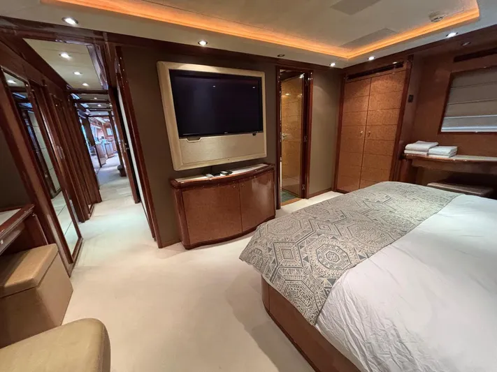 Queen Of Sheba Yacht Photos Pics Luxurious bedroom interior of 2006 Ferretti Yachts 112 Custom Line with modern amenities.