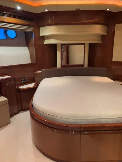 Queen Of Sheba Yacht Photos Pics Luxurious bedroom interior of 2006 Ferretti Yachts 112 Custom Line with elegant wood finishes.