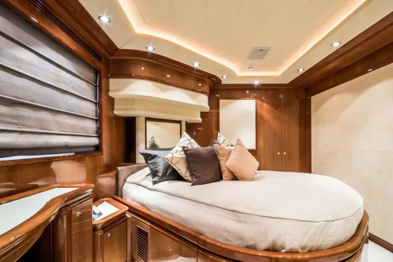 Queen Of Sheba Yacht Photos Pics Luxurious bedroom interior of 2006 Ferretti Yachts 112 Custom Line with elegant wood finishes.